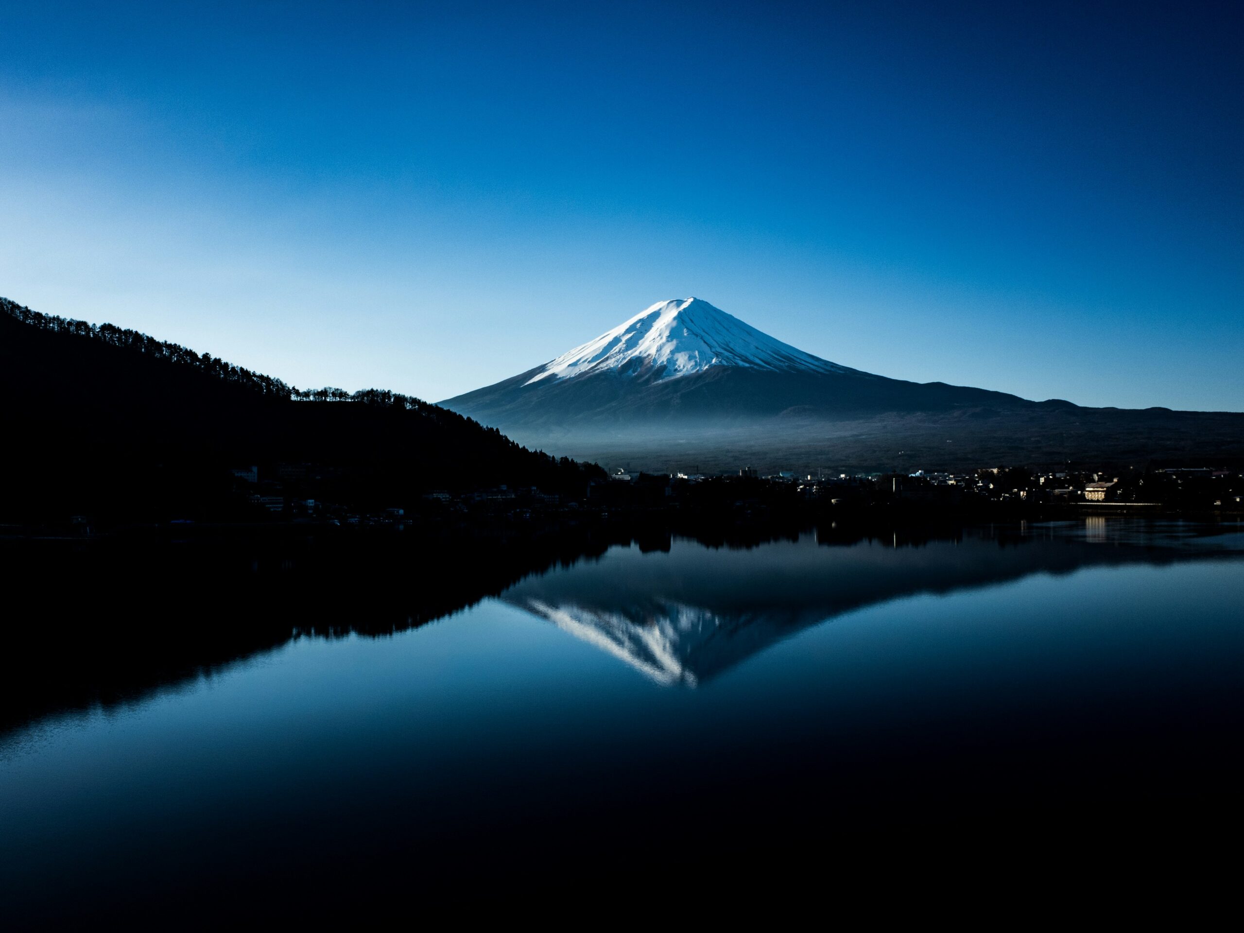 Mt Fuji and reflection on water at night time