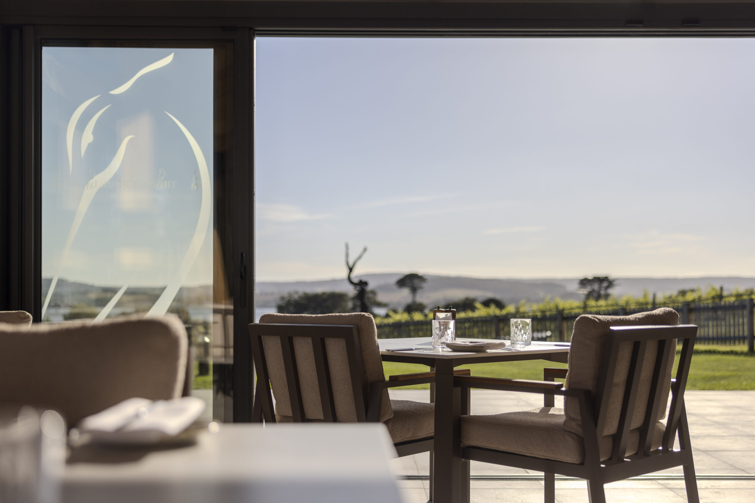 Pool House Restaurant with sunny view over the vineyard and estuary