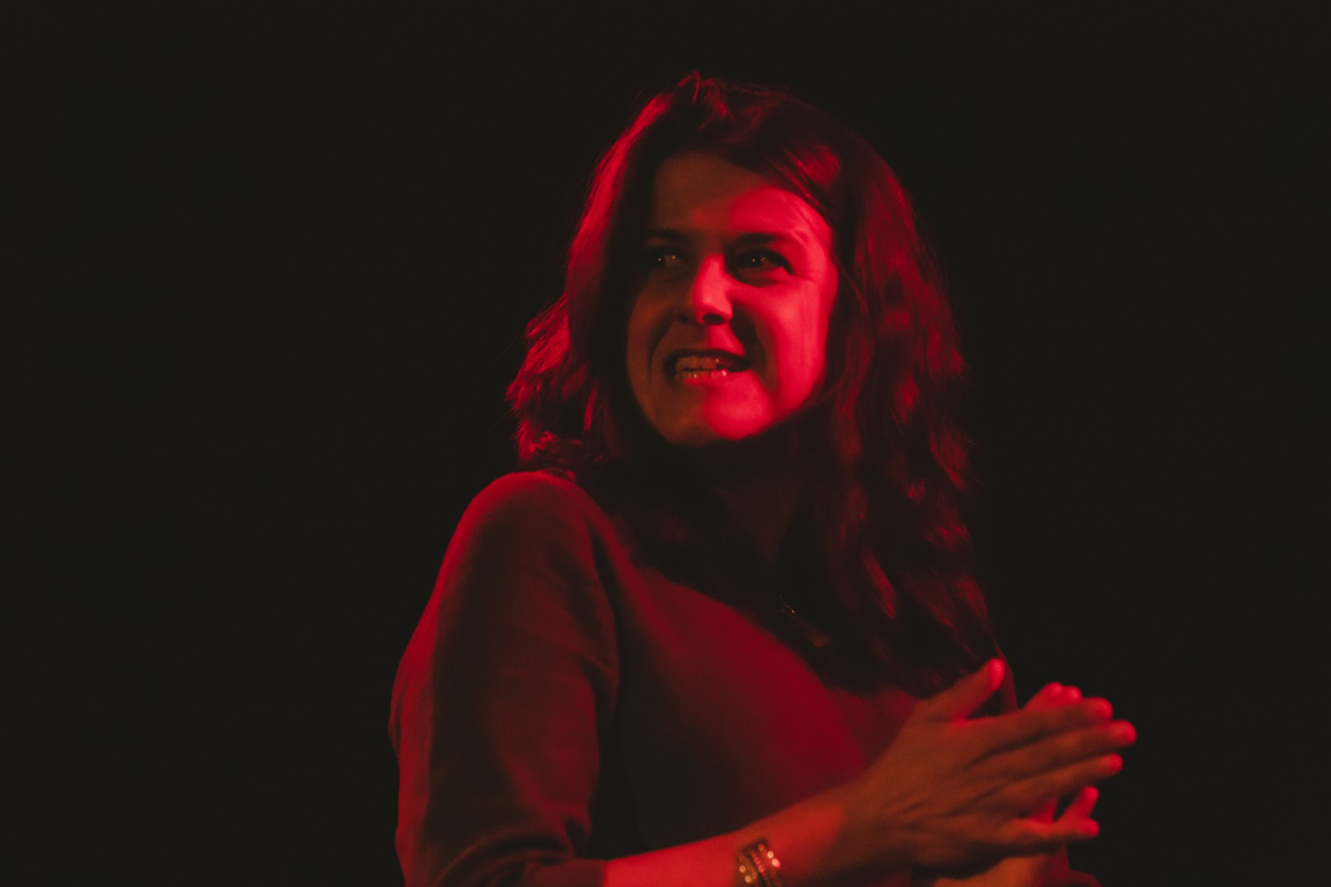 Storyteller Lisa Schneidau on stage performing