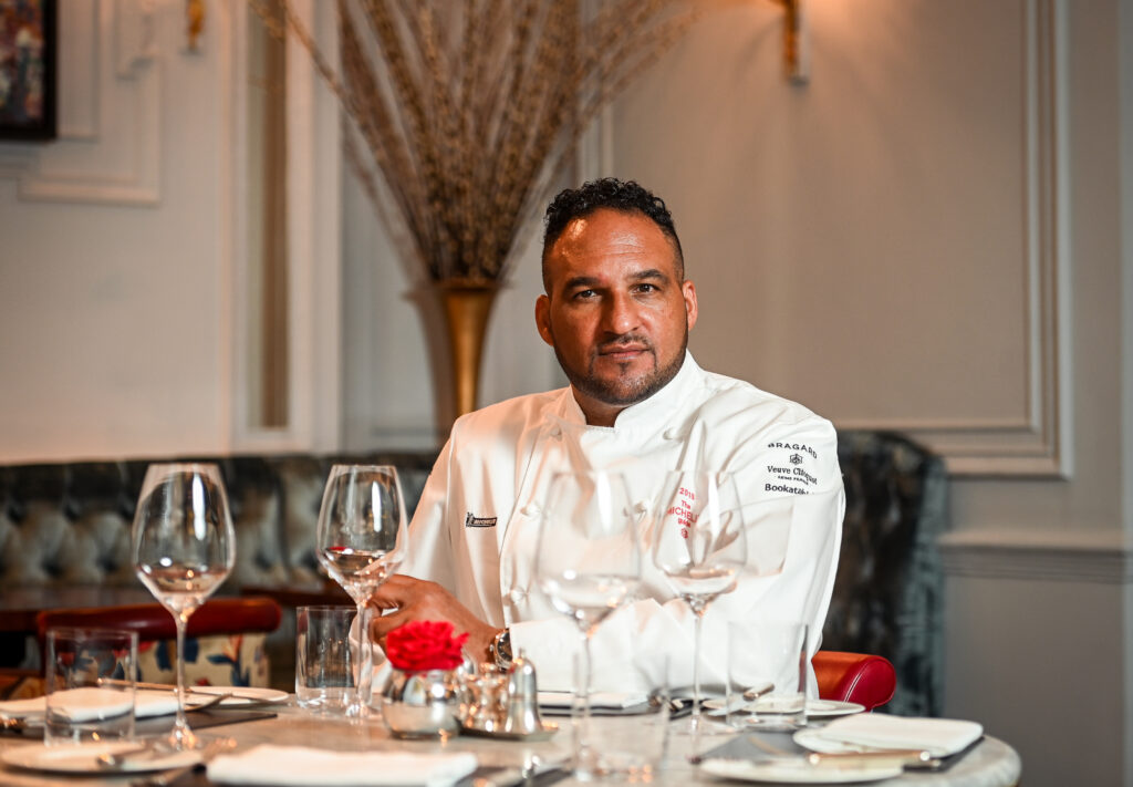 Chef Michael Caines MBE sat in Michael Caines at The Stafford London restaurant
