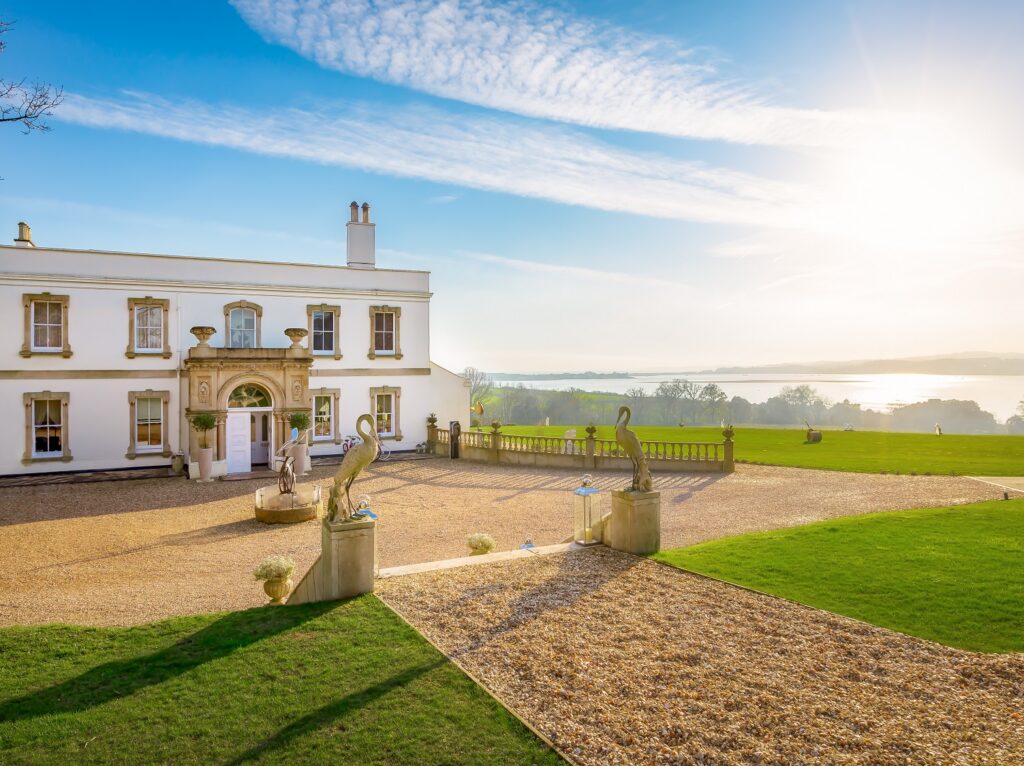 Lympstone Manor with view of estuary in the background