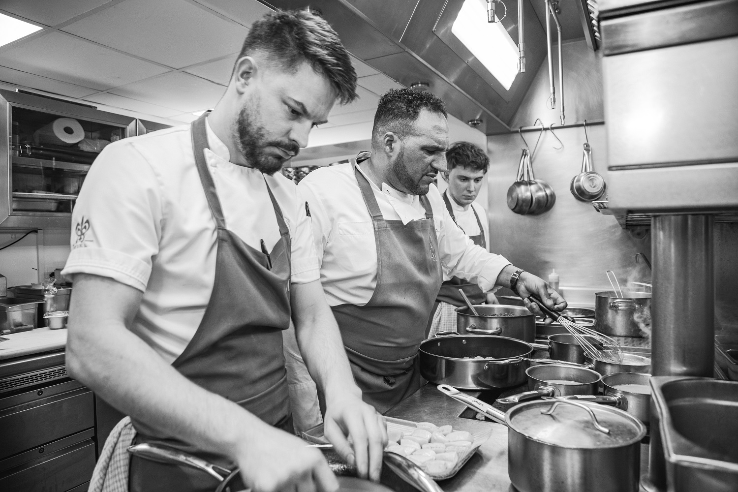 Chef owner Michael Caines, Head Chef Jordan Denning and Lympstone Manor kitchen team during service. 