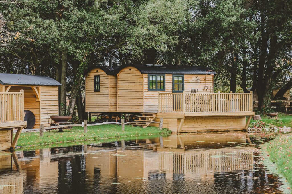 Lympstone Manor shepherd hut in woodland and located on the restored ponds