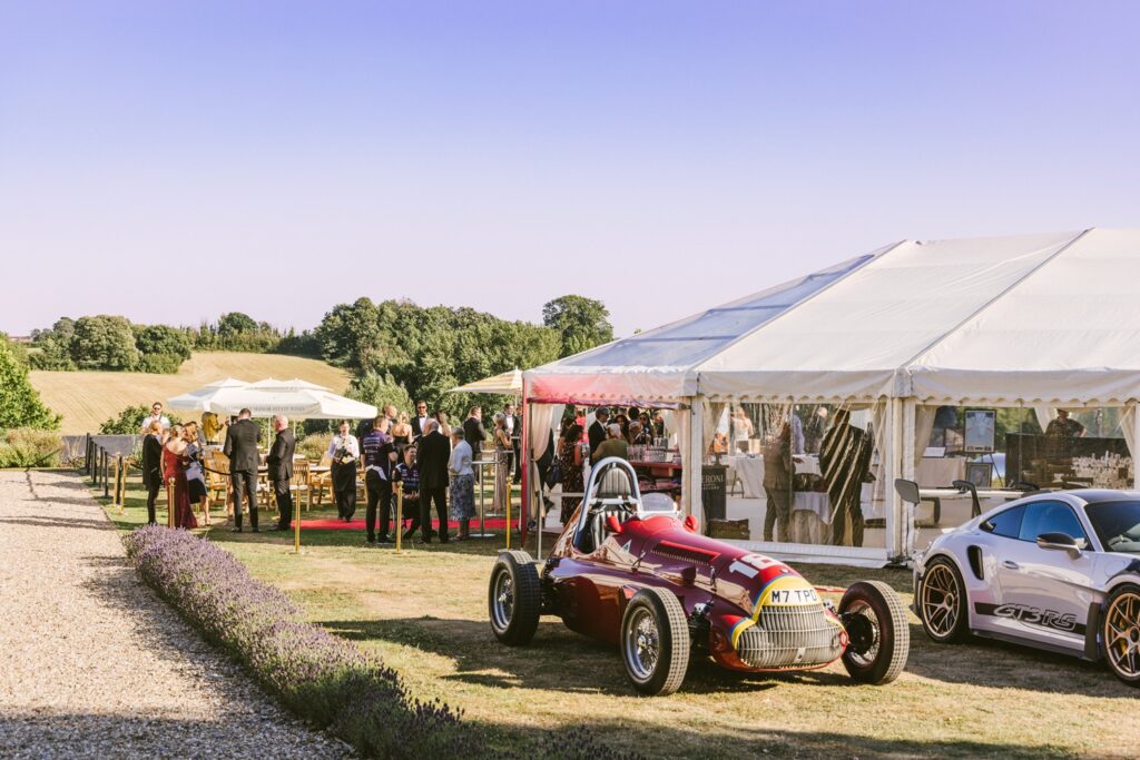 Celebration of Speed Pre-festival Charity Gala Dinner Marquee with sports cars in front