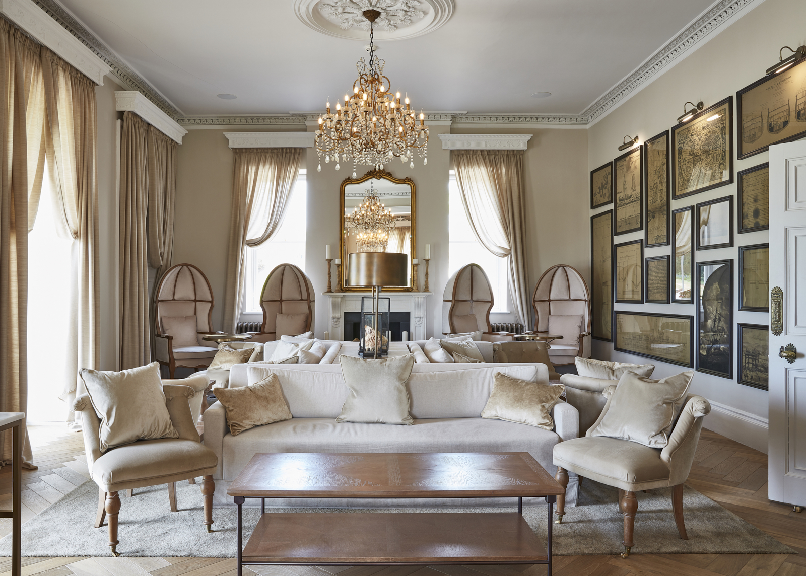 Lympstone Manor Lounge with seating and paintings on wall